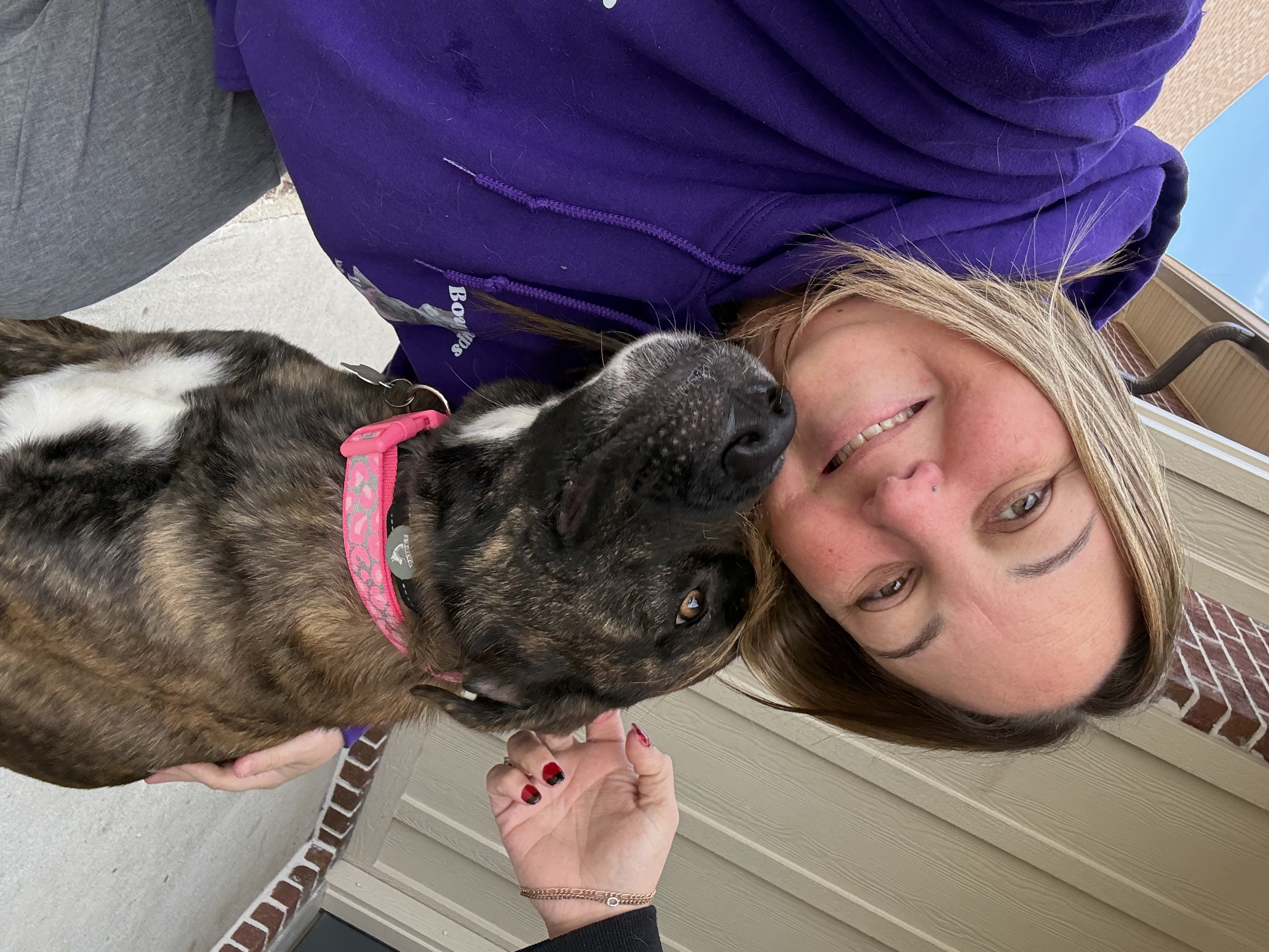 Heather with happy brindle pup